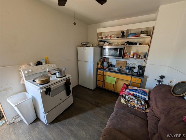 kitchen with dark wood-style floors, white appliances, open shelves, and a sink