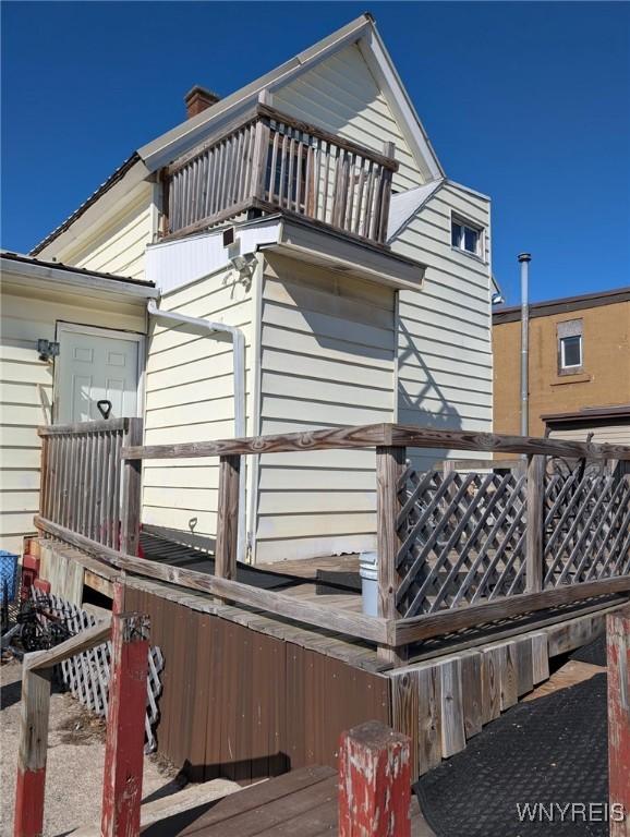 view of property exterior featuring a balcony