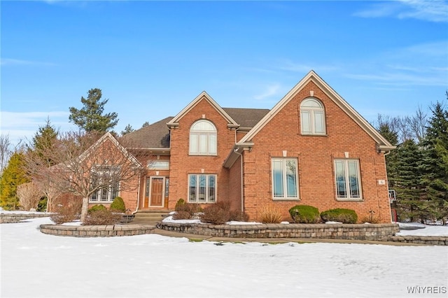 traditional-style home with brick siding