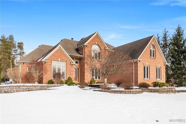 traditional-style home with brick siding