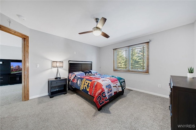 bedroom featuring a ceiling fan, carpet, and baseboards