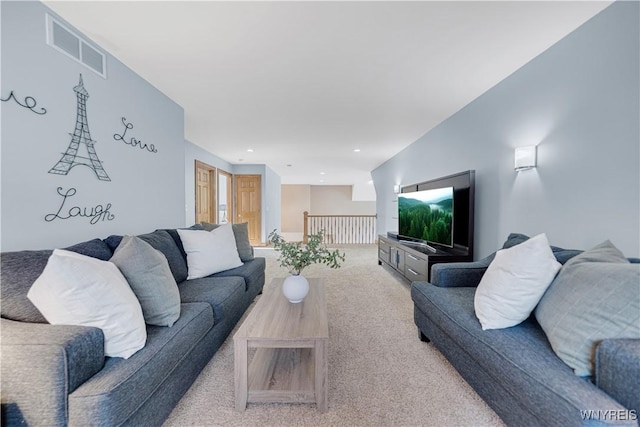 living room featuring visible vents, recessed lighting, and carpet