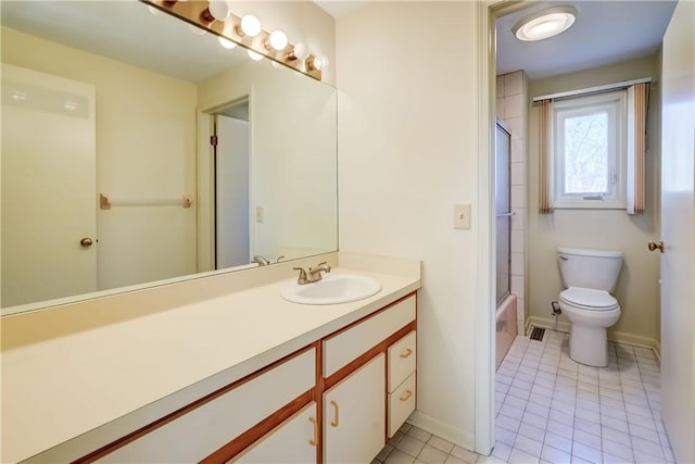 bathroom featuring vanity, tile patterned floors, toilet, and baseboards