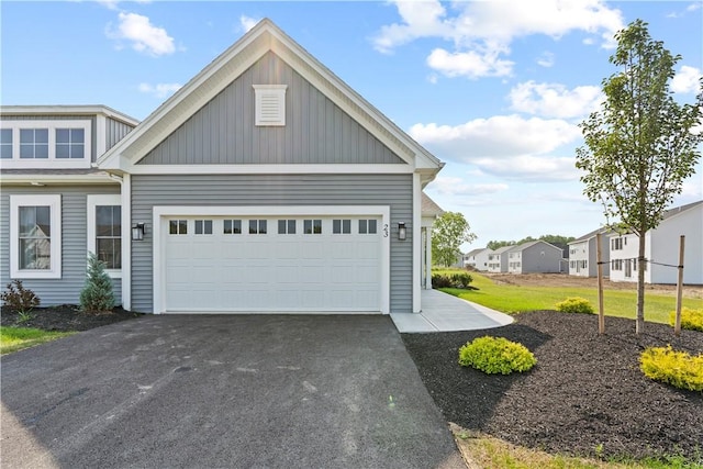 garage featuring aphalt driveway