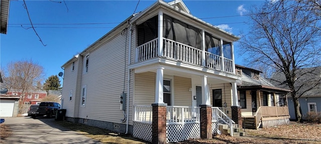 view of front of property with crawl space, covered porch, and concrete driveway