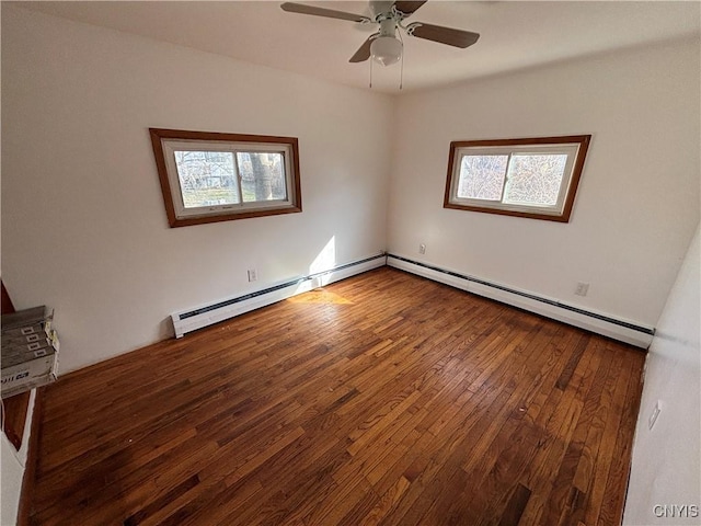 empty room featuring a baseboard radiator, a ceiling fan, and hardwood / wood-style flooring