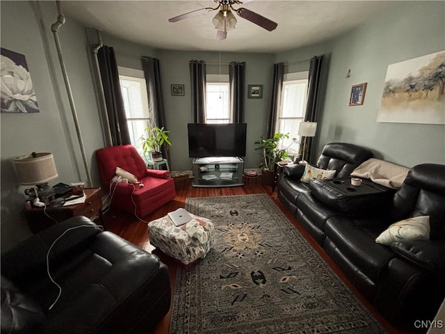 living room featuring wood finished floors and a ceiling fan