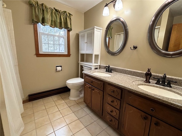 bathroom with tile patterned floors, toilet, double vanity, and a sink