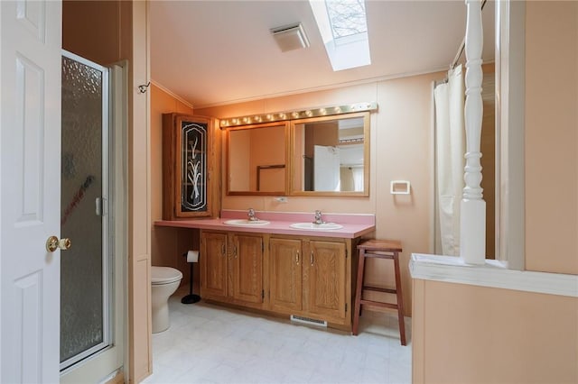 bathroom featuring a sink and a stall shower