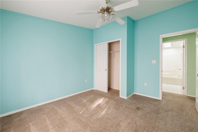 unfurnished bedroom featuring baseboards, carpet floors, a closet, and a ceiling fan