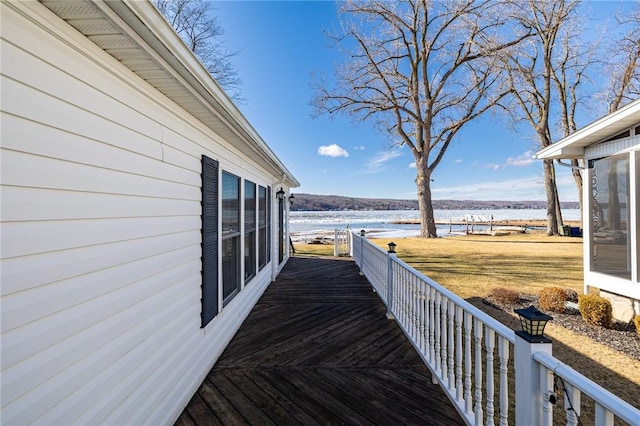 wooden terrace with a water view