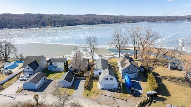 birds eye view of property featuring a residential view and a water view