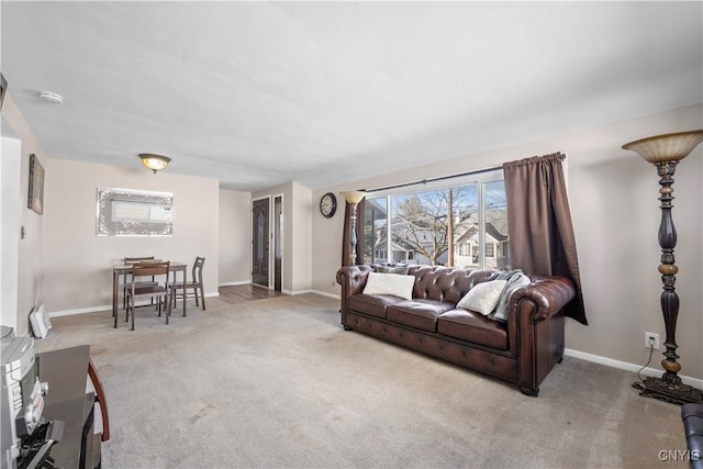 living room with carpet flooring and baseboards