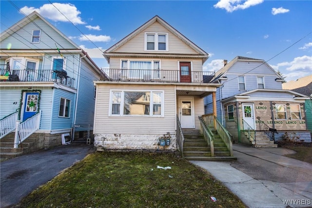 view of front of property with a balcony