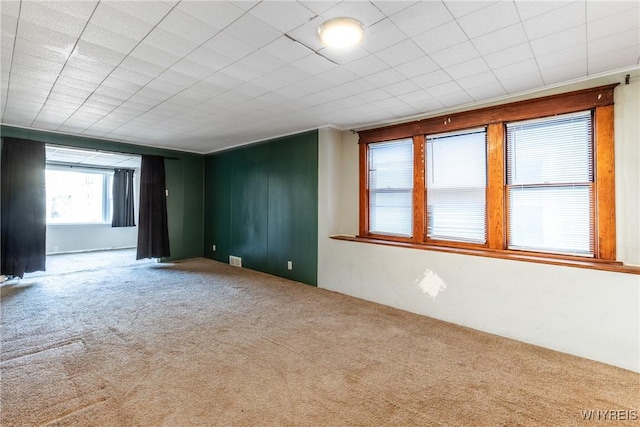 carpeted empty room with visible vents