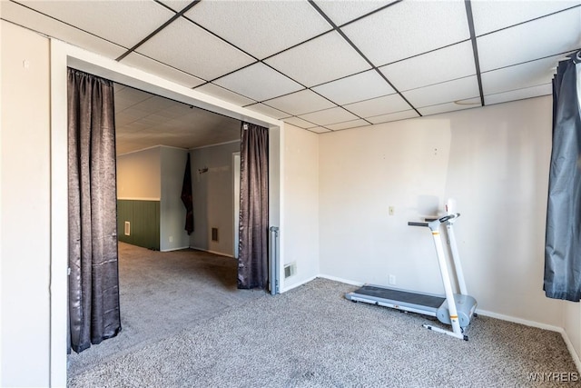 workout room featuring carpet flooring, visible vents, and a drop ceiling