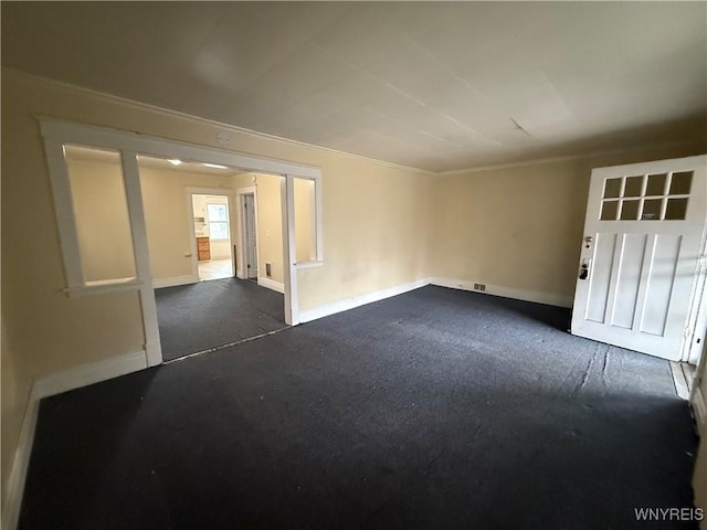 empty room with baseboards