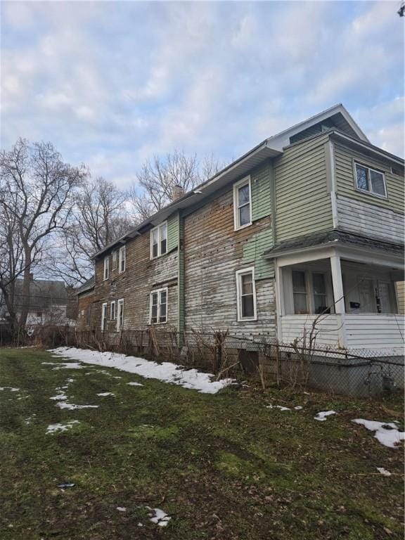 view of property exterior featuring a chimney