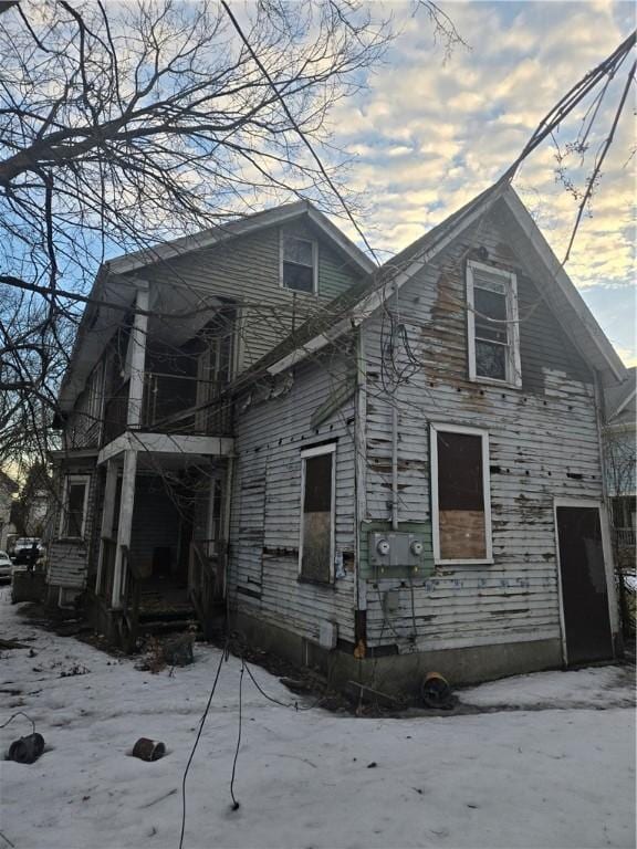 view of side of home with a balcony