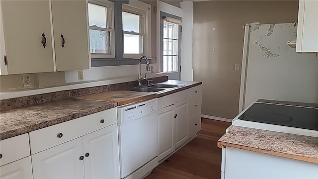 kitchen featuring white cabinetry, white appliances, dark wood finished floors, and a sink