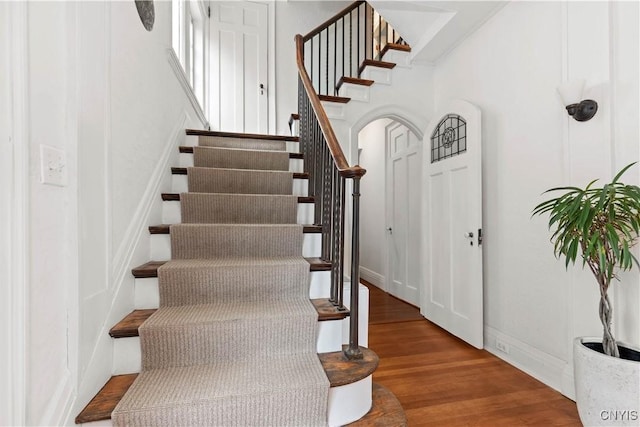 stairs with wood finished floors