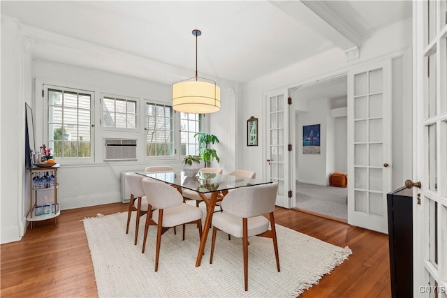 dining room featuring cooling unit, french doors, baseboards, and wood finished floors