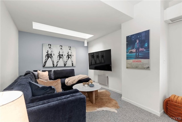 carpeted living area featuring baseboards and a skylight