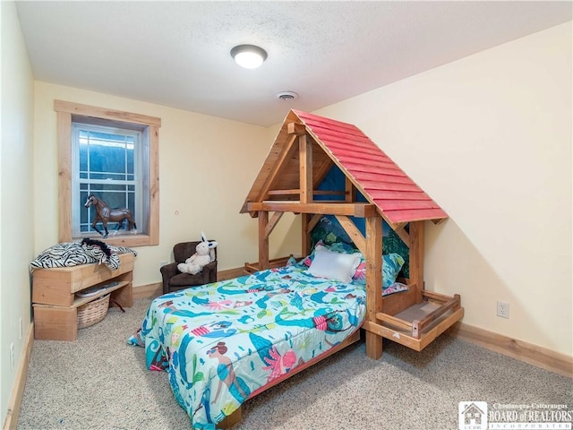 carpeted bedroom featuring visible vents and a textured ceiling