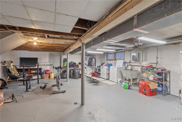 unfinished basement with washer and dryer and a sink