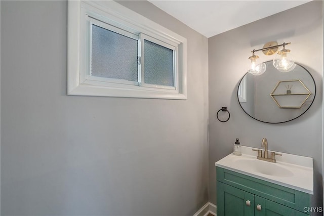 bathroom with vanity and baseboards