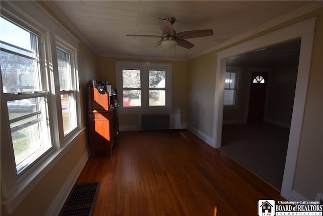 unfurnished sunroom featuring visible vents, a healthy amount of sunlight, and ceiling fan