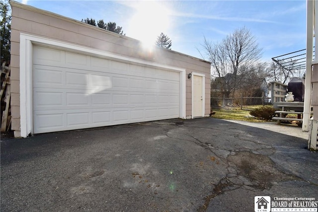 garage featuring fence