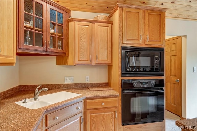 kitchen with wood ceiling, black appliances, glass insert cabinets, and a sink