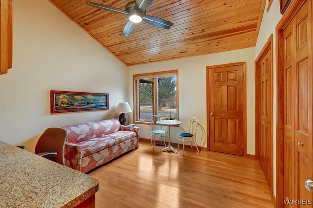 living room featuring baseboards, ceiling fan, wood ceiling, vaulted ceiling, and light wood-style flooring