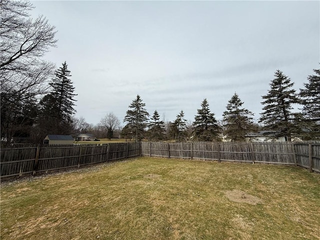 view of yard with a fenced backyard