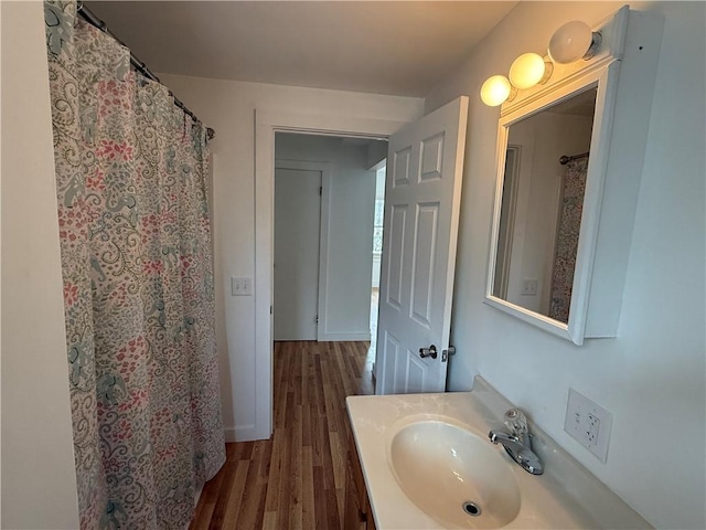 bathroom featuring vanity and wood finished floors