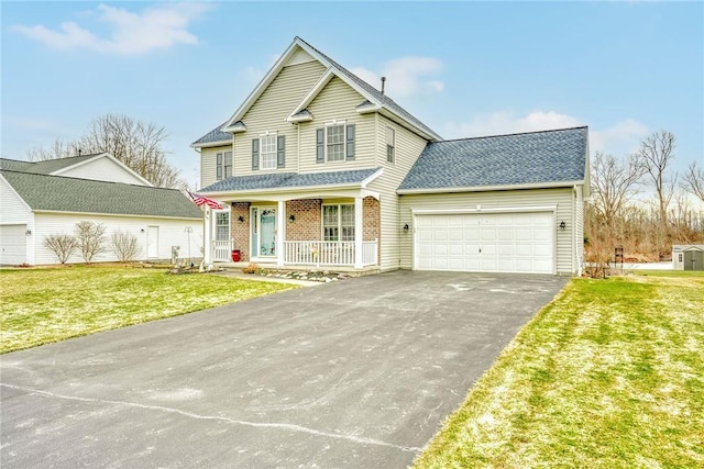 traditional home featuring brick siding, a front lawn, aphalt driveway, a porch, and an attached garage