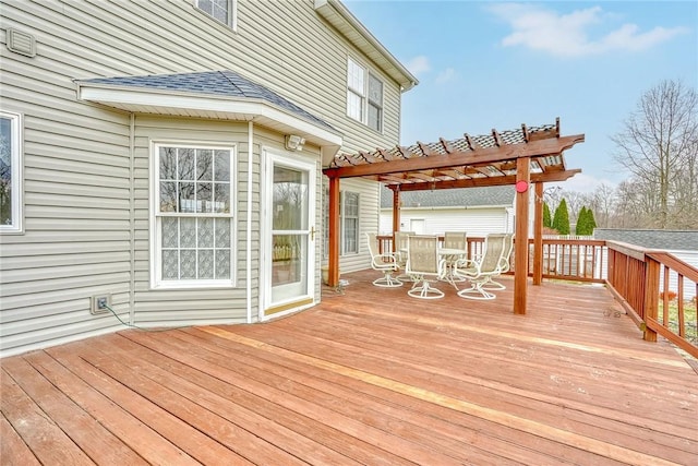 deck with outdoor dining area and a pergola