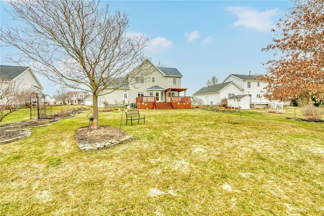 view of yard with a wooden deck