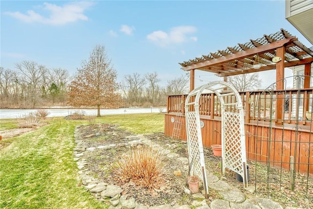 view of yard featuring a pergola and a water view