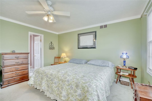 bedroom with light carpet, visible vents, and ornamental molding