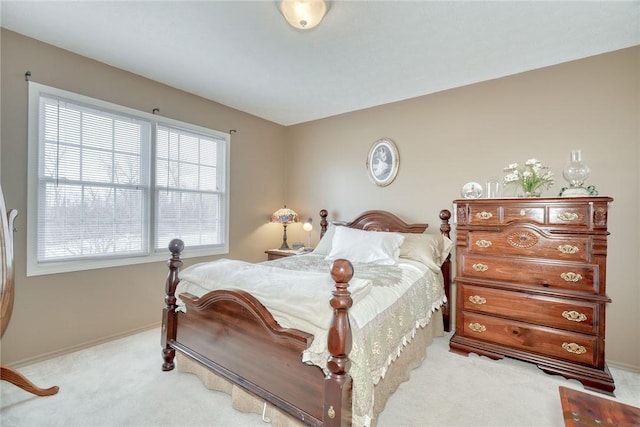 bedroom featuring baseboards and carpet floors