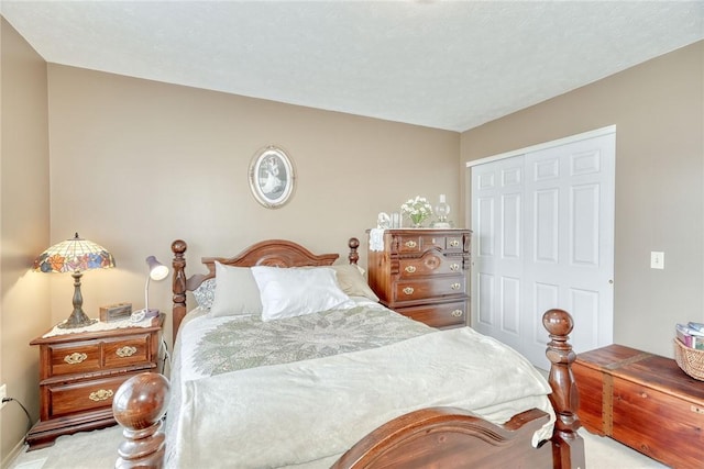 carpeted bedroom featuring a closet