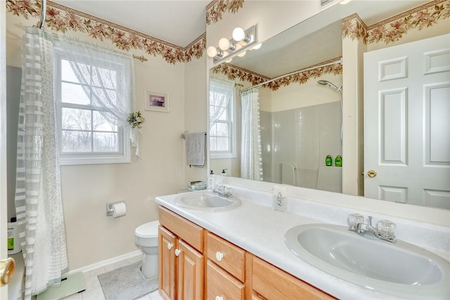 full bathroom with a shower with curtain, tile patterned floors, toilet, and a sink