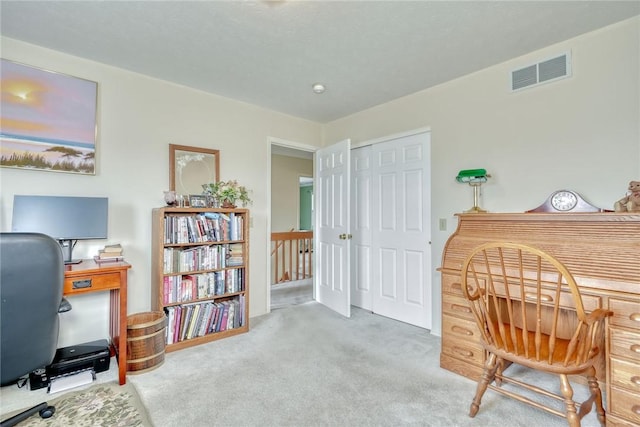 home office with visible vents and carpet