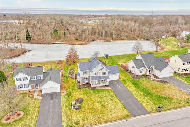 bird's eye view featuring a residential view and a view of trees