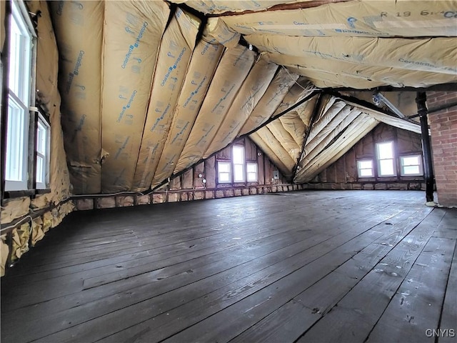 unfinished attic with a healthy amount of sunlight