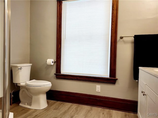37 Niagara St, Oswego-City, NY 13126 - bathroom featuring wood finished floors, toilet, vanity, and baseboards