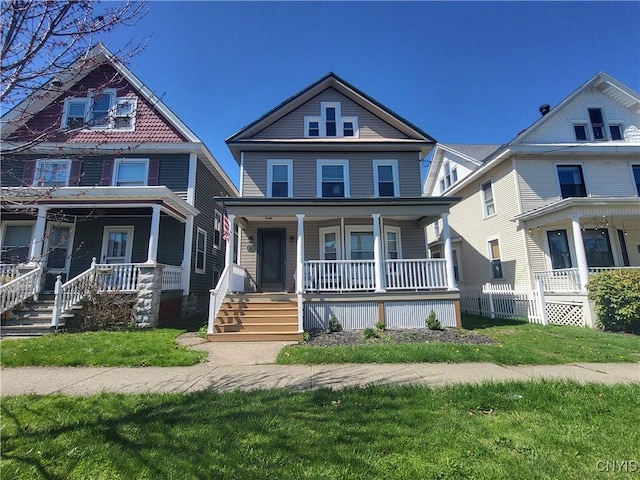 37 Niagara St, Oswego-City, NY 13126 - traditional style home featuring a front yard and covered porch