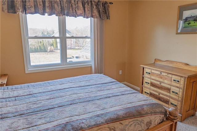 bedroom featuring carpet